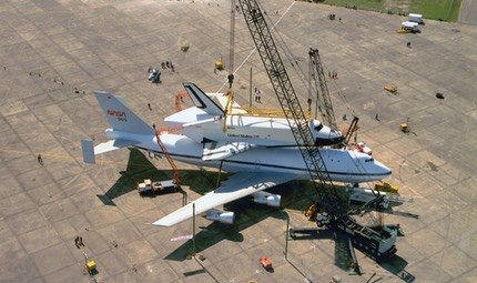Space Shuttle Enterprise being lifted onto a NASA Boeing 747 Shuttle Carrier Aircraft